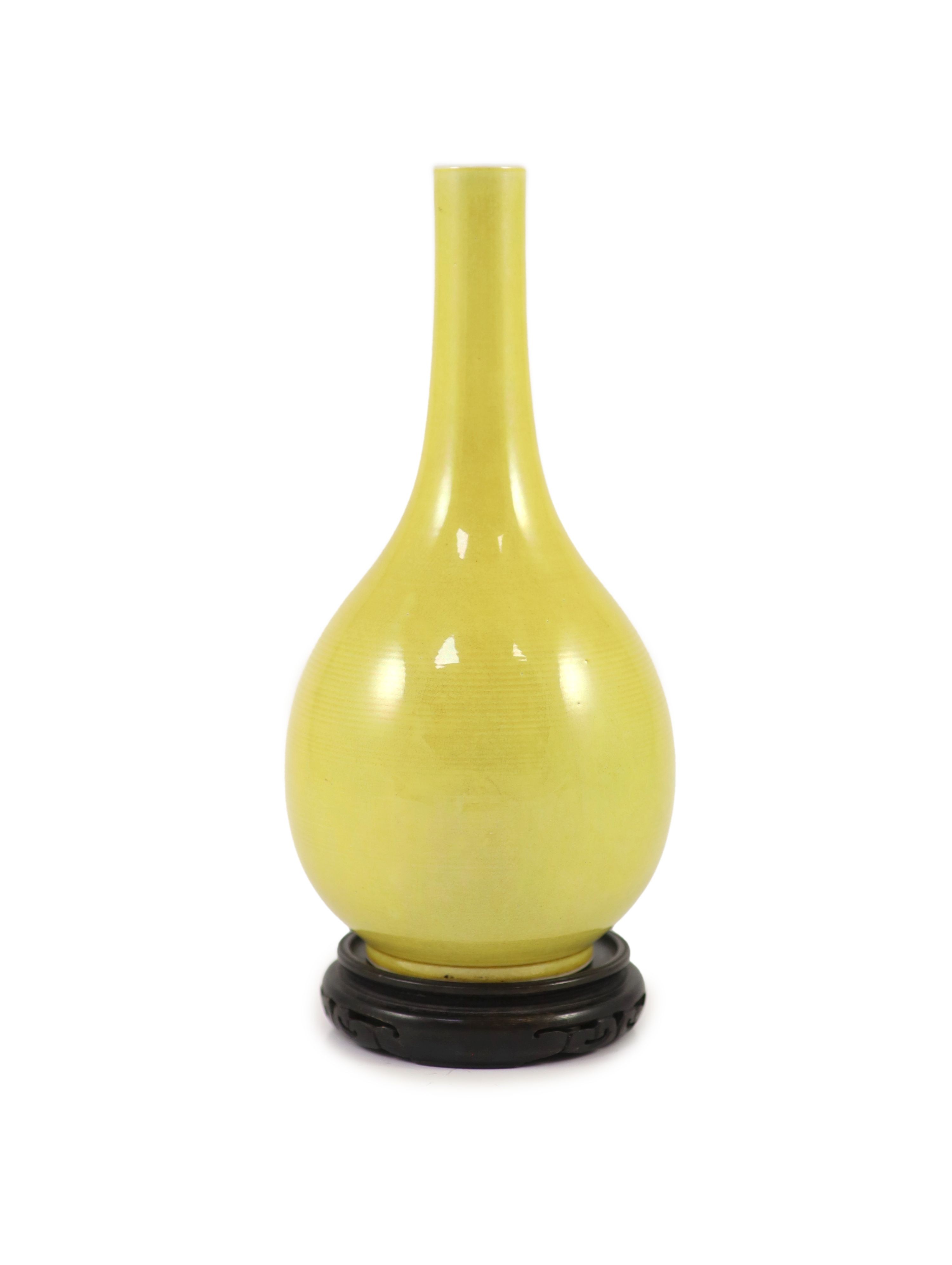 A Chinese yellow ground narrow neck bottle vase, Yongzheng mark but mid 20th century, 24.5cm high, wood stand